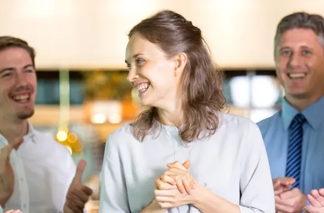Group of business people laughing together at a networking event