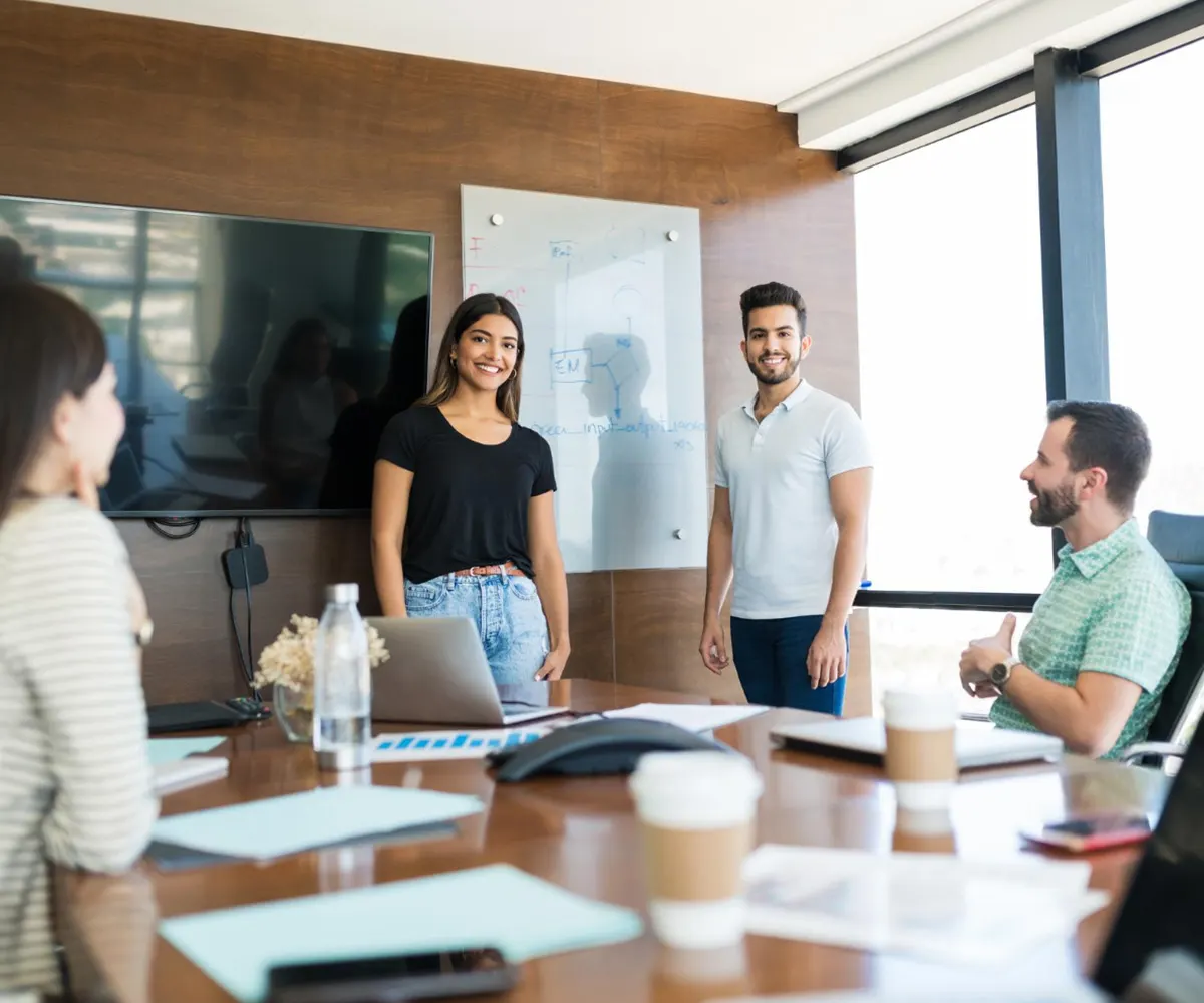 Colleagues discussing ideas around a conference table